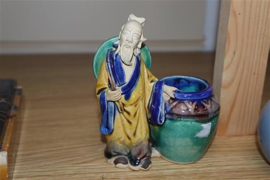 A Chinese blue glazed bottle vase, Kangxi mark but Republic period and a Chinese pottery figure tallest 12cm